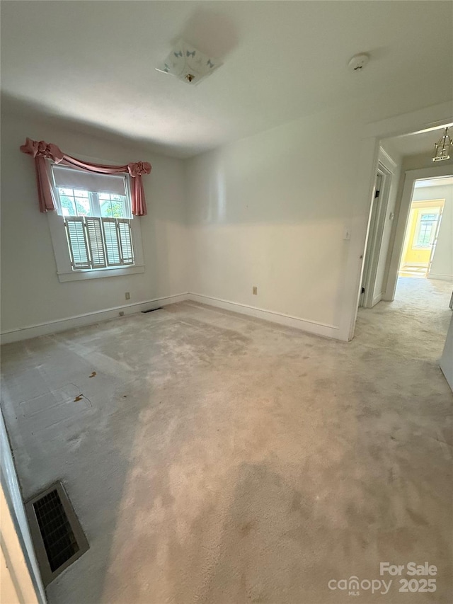 3586 US-70 Rd W, Marion, NC 28752 - spare room with baseboards, healthy amount of natural light, light colored carpet, and a smoke detector