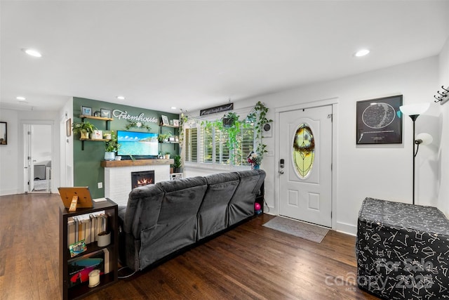 7921 Willhill Rd, Mint Hill, NC 28227 - living room with a brick fireplace, wood finished floors, recessed lighting, and baseboards