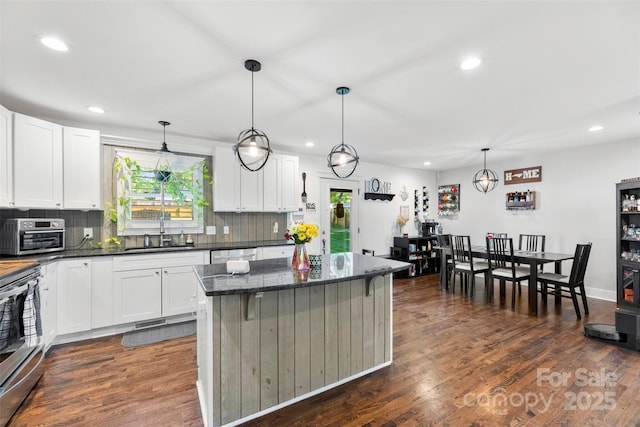 7921 Willhill Rd, Mint Hill, NC 28227 - kitchen with a sink, range, recessed lighting, tasteful backsplash, and dark wood finished floors
