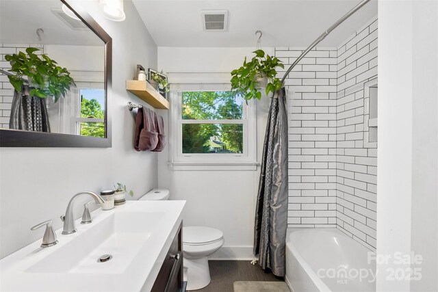 7921 Willhill Rd, Mint Hill, NC 28227 - full bathroom featuring toilet, vanity, shower / bathtub combination with curtain, and wood finished floors