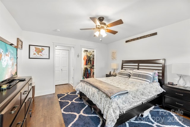 7921 Willhill Rd, Mint Hill, NC 28227 - bedroom featuring dark wood-style floors, baseboards, a walk in closet, a closet, and ceiling fan