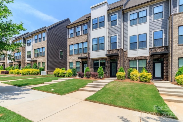 628 Uwharrie River Rd, Charlotte, NC 28211 - view of front of property with a front yard, a residential view, and brick siding