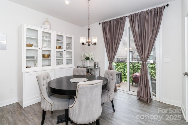 628 Uwharrie River Rd, Charlotte, NC 28211 - dining space featuring wood finished floors, baseboards, and a chandelier