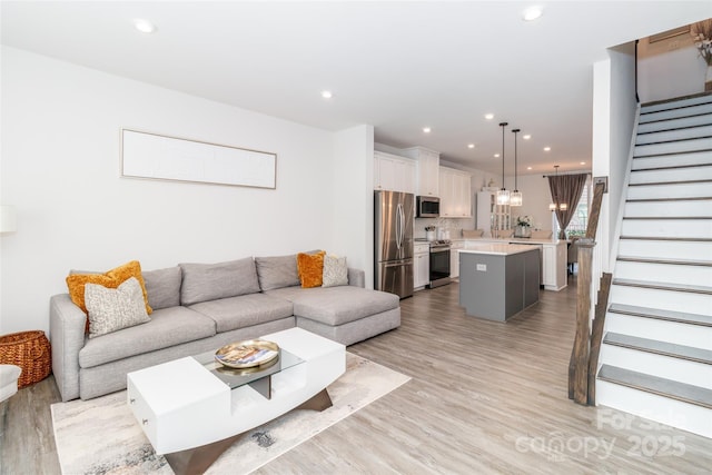 628 Uwharrie River Rd, Charlotte, NC 28211 - living room with stairway, light wood-style flooring, and recessed lighting