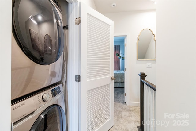 628 Uwharrie River Rd, Charlotte, NC 28211 - laundry area featuring stacked washer / dryer, carpet, and baseboards