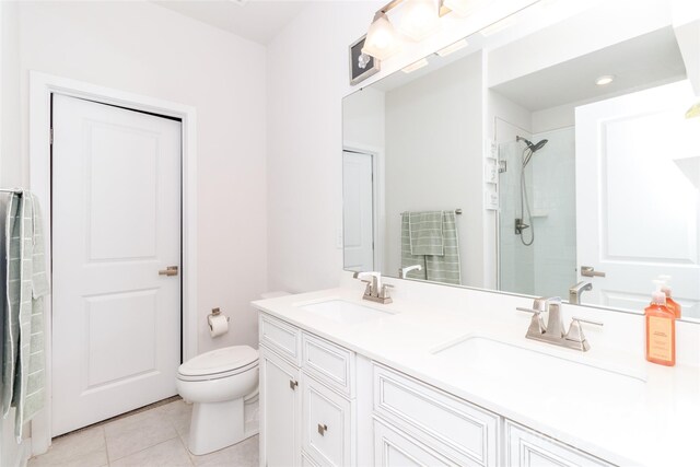 628 Uwharrie River Rd, Charlotte, NC 28211 - bathroom with tile patterned flooring, toilet, double vanity, and a shower