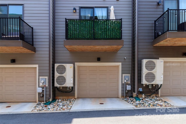 628 Uwharrie River Rd, Charlotte, NC 28211 - property entrance featuring a balcony, a cooling unit, and a garage