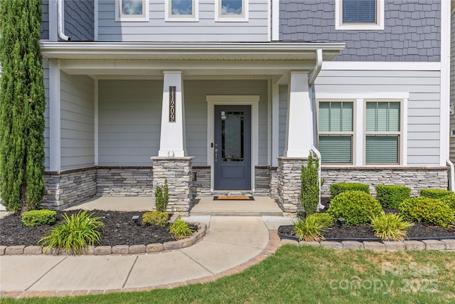 11209 Flenniken Ct, Charlotte, NC 28277 - property entrance featuring stone siding and a porch