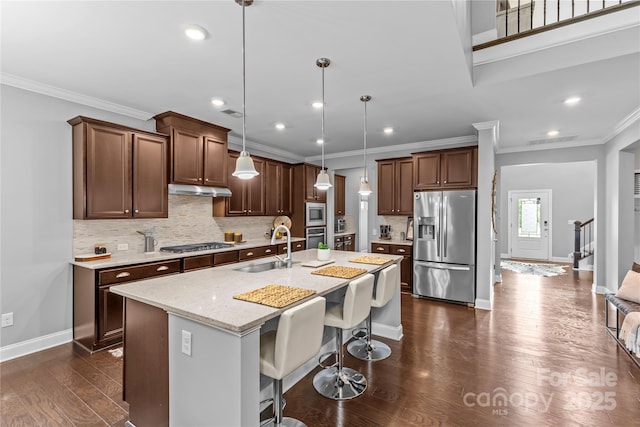 11209 Flenniken Ct, Charlotte, NC 28277 - kitchen with stainless steel appliances, a sink, baseboards, crown molding, and dark wood-style floors