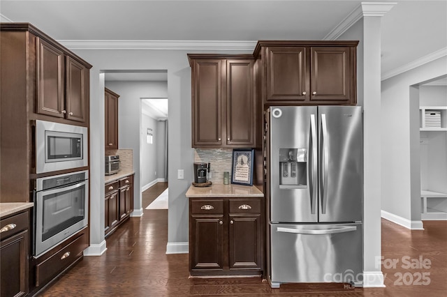 11209 Flenniken Ct, Charlotte, NC 28277 - kitchen with appliances with stainless steel finishes, baseboards, decorative backsplash, dark wood-style flooring, and crown molding