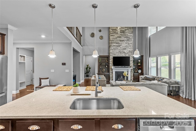 11209 Flenniken Ct, Charlotte, NC 28277 - kitchen featuring a sink, an island with sink, dark brown cabinets, stainless steel appliances, and open floor plan