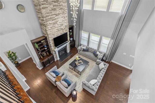 11209 Flenniken Ct, Charlotte, NC 28277 - living room featuring a high ceiling, wood finished floors, plenty of natural light, and baseboards