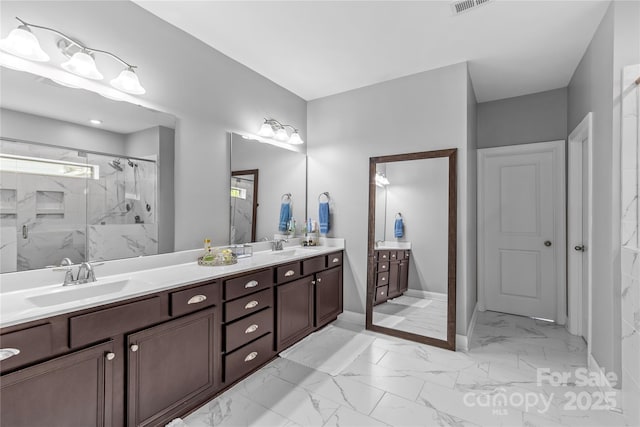 11209 Flenniken Ct, Charlotte, NC 28277 - full bathroom featuring marble look tiles, double vanity, a marble finish shower, and baseboards