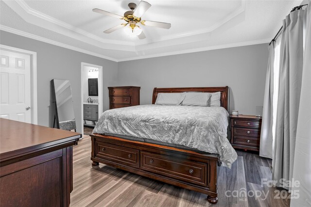 532 Jedburgh Way, Rock Hill, SC 29730 - bedroom featuring a tray ceiling, wood finished floors, crown molding, ceiling fan, and connected bathroom
