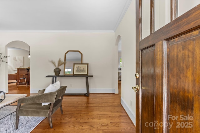 1500 Lynway Dr, Charlotte, NC 28203 - entrance foyer with arched walkways, ornamental molding, wood finished floors, and baseboards