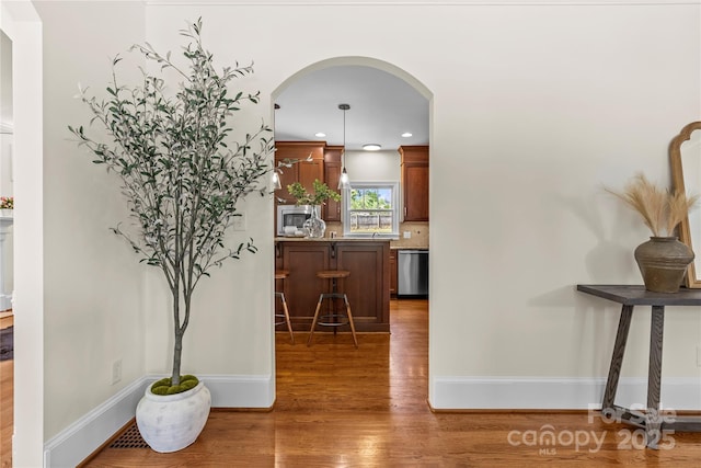 1500 Lynway Dr, Charlotte, NC 28203 - corridor with arched walkways, wood finished floors, baseboards, and recessed lighting