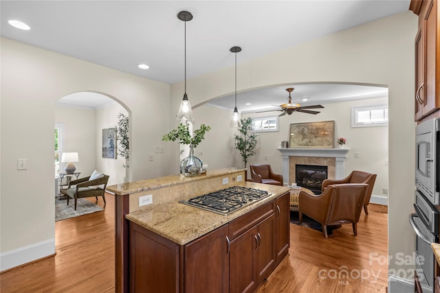 1500 Lynway Dr, Charlotte, NC 28203 - kitchen with stainless steel appliances, open floor plan, arched walkways, a ceiling fan, and recessed lighting