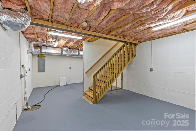 1500 Lynway Dr, Charlotte, NC 28203 - unfinished below grade area with electric panel, stairway, and concrete block wall