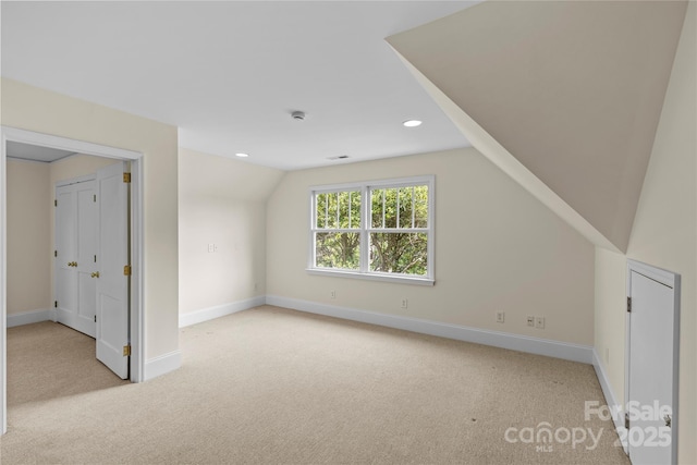 1500 Lynway Dr, Charlotte, NC 28203 - additional living space with light carpet, lofted ceiling, baseboards, and recessed lighting