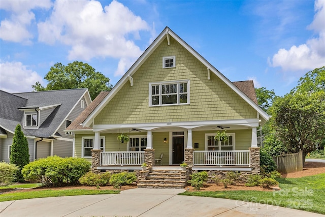 1500 Lynway Dr, Charlotte, NC 28203 - craftsman-style house featuring a porch, stone siding, and a ceiling fan