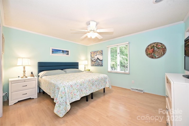 3017 Brooks Mill Ln, Wingate, NC 28174 - bedroom featuring light wood-style flooring, crown molding, ceiling fan, and baseboards