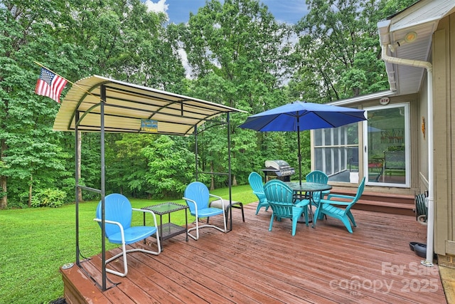 3017 Brooks Mill Ln, Wingate, NC 28174 - wooden deck featuring a lawn, view of scattered trees, and area for grilling