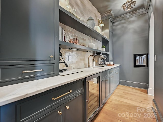 735 Davidson Run Ln, Davidson, NC 28036 - indoor wet bar featuring wine cooler, tasteful backsplash, light wood finished floors, ornamental molding, and baseboards