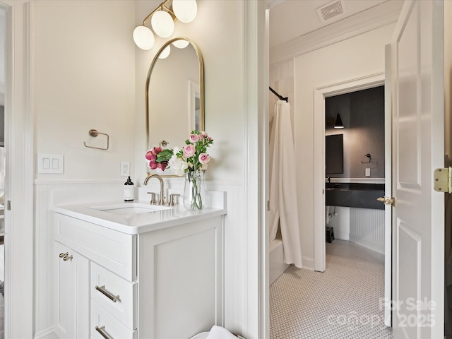 735 Davidson Run Ln, Davidson, NC 28036 - bathroom featuring vanity, shower / tub combo, wainscoting, tile patterned floors, and a decorative wall