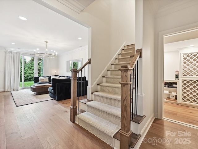 735 Davidson Run Ln, Davidson, NC 28036 - stairs with ornamental molding, wood-type flooring, a chandelier, and recessed lighting