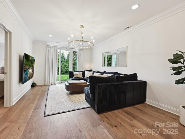 735 Davidson Run Ln, Davidson, NC 28036 - living area with a chandelier, ornamental molding, light wood-style floors, baseboards, and recessed lighting