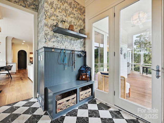 735 Davidson Run Ln, Davidson, NC 28036 - mudroom with healthy amount of natural light, arched walkways, wallpapered walls, and ceiling fan