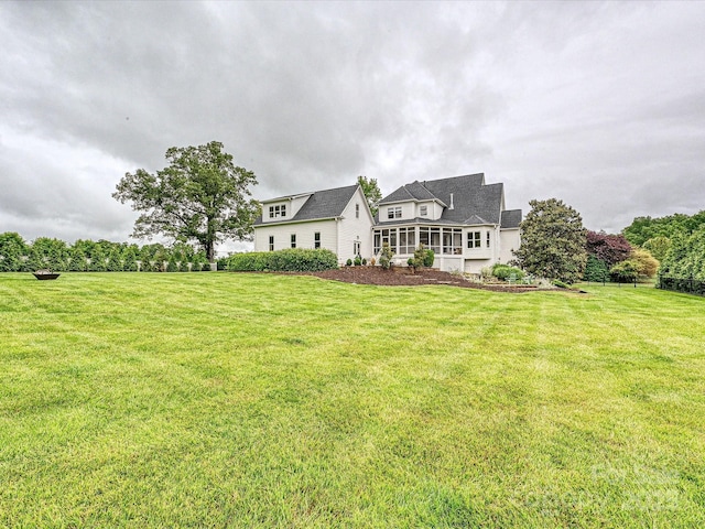 735 Davidson Run Ln, Davidson, NC 28036 - rear view of property with a lawn and a sunroom