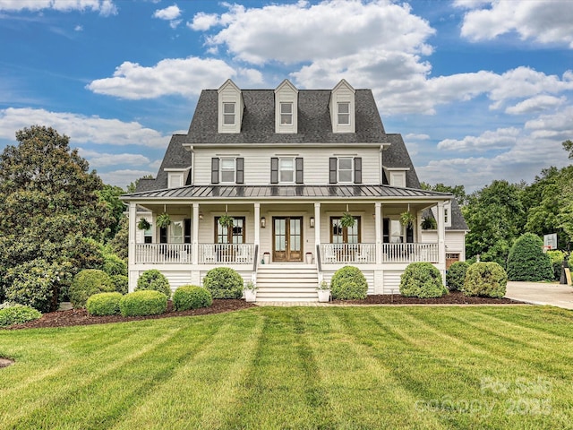 735 Davidson Run Ln, Davidson, NC 28036 - view of front facade featuring a standing seam roof, a porch, a front yard, and metal roof