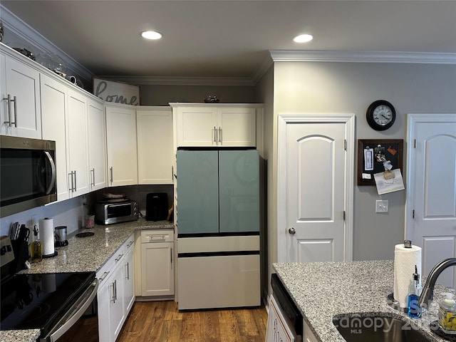 110 W Pine St, Lincolnton, NC 28092 - kitchen with freestanding refrigerator, stainless steel microwave, range with electric stovetop, crown molding, and light stone countertops