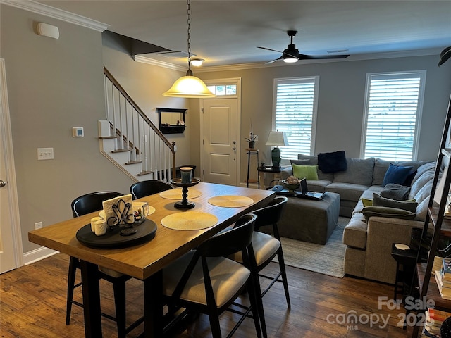 110 W Pine St, Lincolnton, NC 28092 - dining space featuring ornamental molding, a ceiling fan, stairs, dark wood-style floors, and plenty of natural light