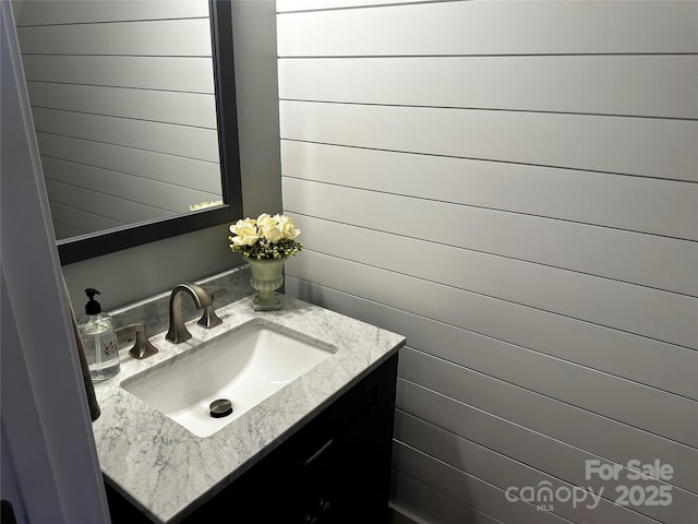 110 W Pine St, Lincolnton, NC 28092 - bathroom with vanity and wooden walls
