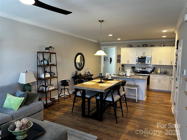 110 W Pine St, Lincolnton, NC 28092 - dining area featuring ornamental molding, dark wood-style flooring, and recessed lighting