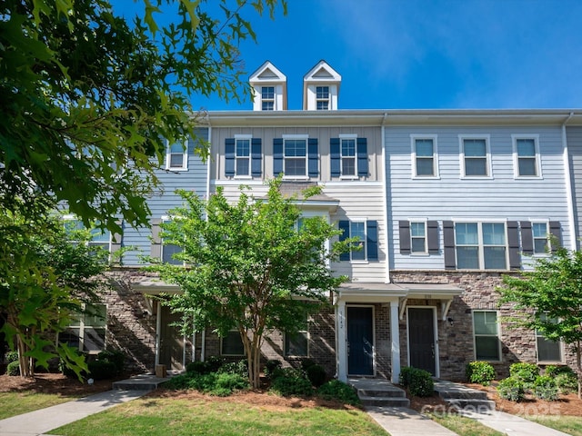 1142 Doveridge St, Charlotte, NC 28273 - view of property featuring stone siding