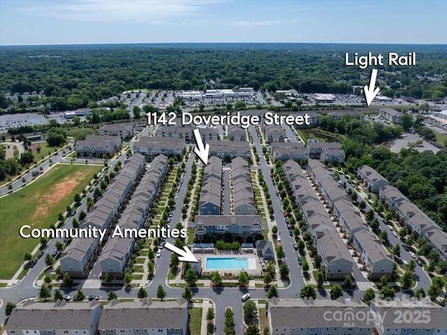 1142 Doveridge St, Charlotte, NC 28273 - aerial view of property and surrounding area with a pool, nearby suburban area, and a heavily wooded area