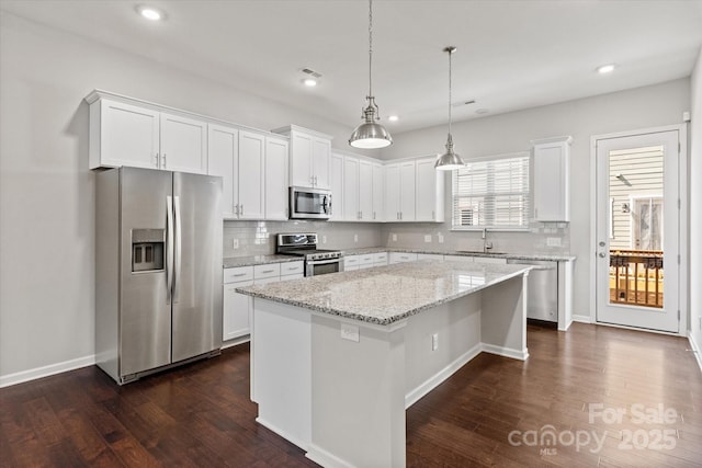 1142 Doveridge St, Charlotte, NC 28273 - kitchen featuring stainless steel appliances, a sink, a center island, tasteful backsplash, and recessed lighting