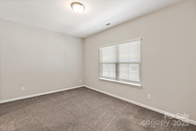 1142 Doveridge St, Charlotte, NC 28273 - empty room with dark colored carpet and baseboards