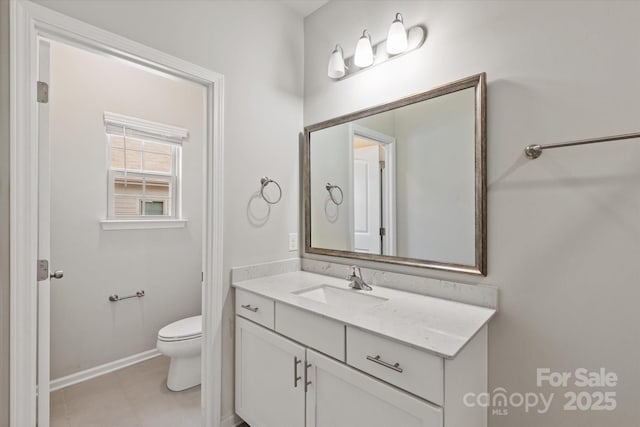 1142 Doveridge St, Charlotte, NC 28273 - bathroom with toilet, vanity, and baseboards