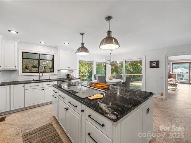 15 Old Stage Trl, Clover, SC 29710 - kitchen with a sink, black electric cooktop, plenty of natural light, white cabinets, and recessed lighting