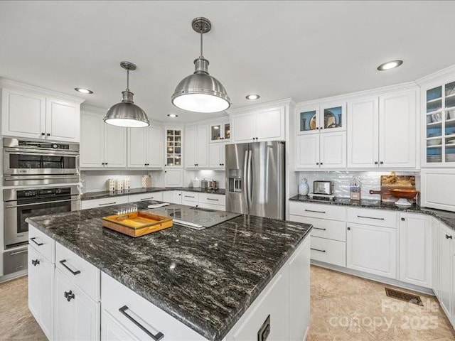 15 Old Stage Trl, Clover, SC 29710 - kitchen with stainless steel appliances, recessed lighting, white cabinetry, a warming drawer, and hanging light fixtures