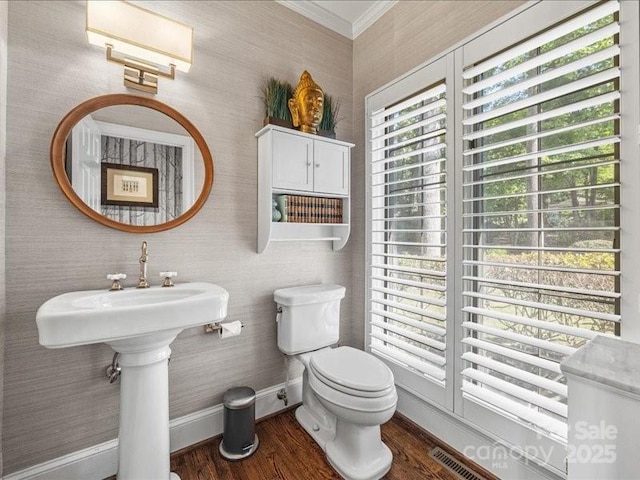15 Old Stage Trl, Clover, SC 29710 - bathroom with baseboards, wood finished floors, toilet, crown molding, and wallpapered walls
