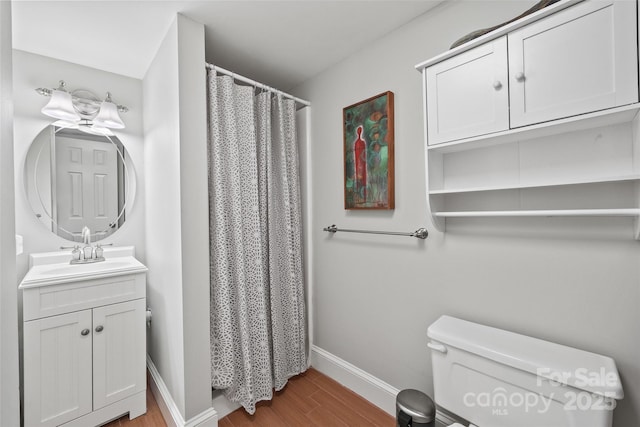 15 Old Stage Trl, Clover, SC 29710 - full bathroom featuring wood finished floors, toilet, vanity, baseboards, and curtained shower