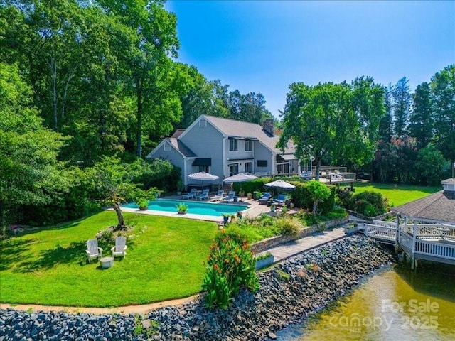 15 Old Stage Trl, Clover, SC 29710 - back of property with a yard, an outdoor pool, a water view, and view of scattered trees