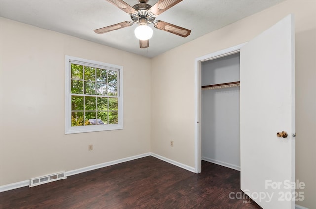 25 Evelake Dr, Asheville, NC 28806 - unfurnished bedroom with wood finished floors, baseboards, a closet, and a ceiling fan
