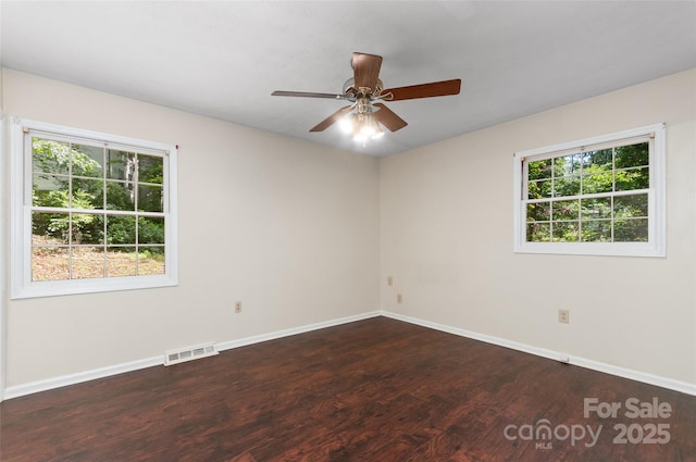 25 Evelake Dr, Asheville, NC 28806 - spare room featuring wood finished floors, plenty of natural light, baseboards, and a ceiling fan