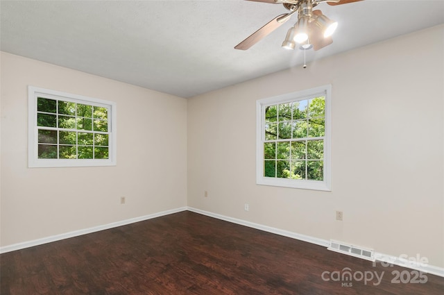 25 Evelake Dr, Asheville, NC 28806 - empty room featuring ceiling fan, wood finished floors, plenty of natural light, and baseboards
